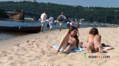 Wicked young nudist enjoys being topless at the beach - hclips.com