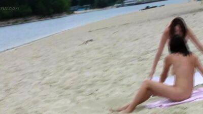 Stunning young nudist babes relax at the beach - drtuber.com